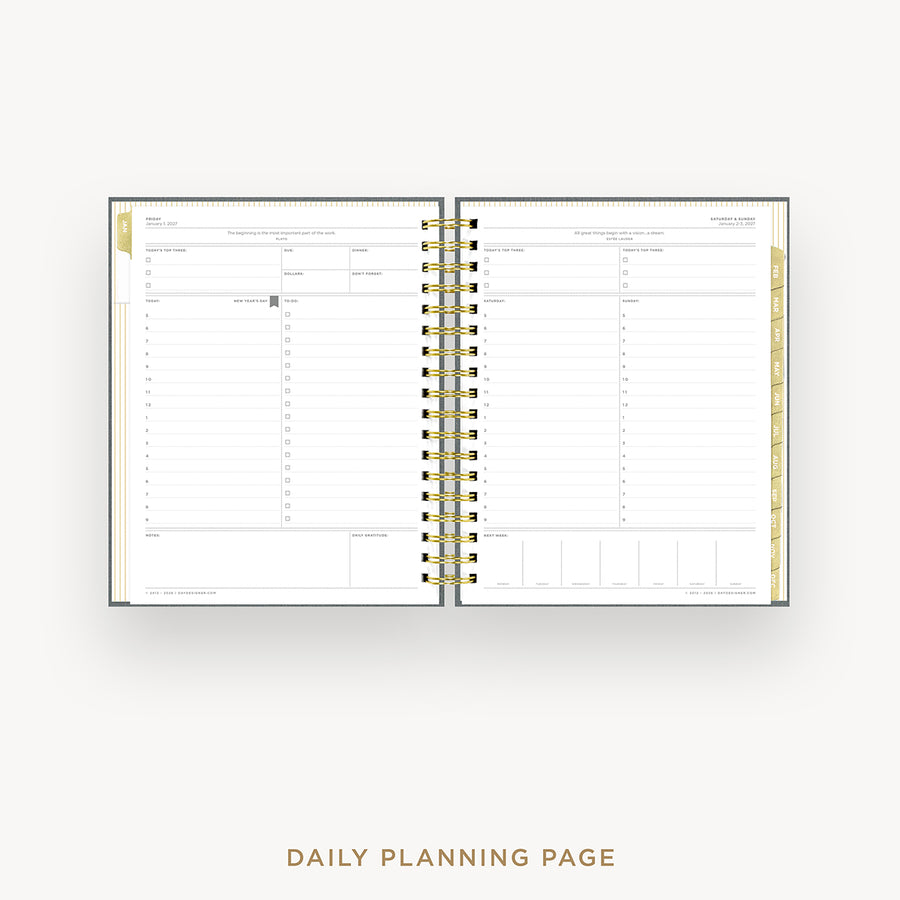 Wire-bound planner with daily planning pages on a white background