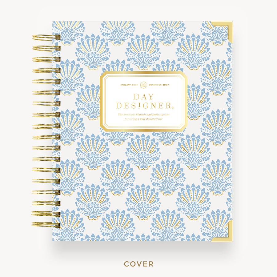 Patterned notebook with 'Day Designer' branding on a white background
