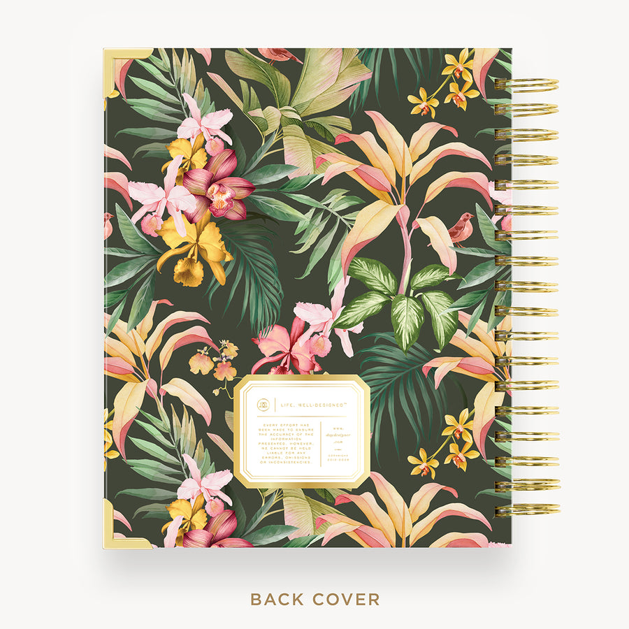 Planner with tropical floral design on a dark green background