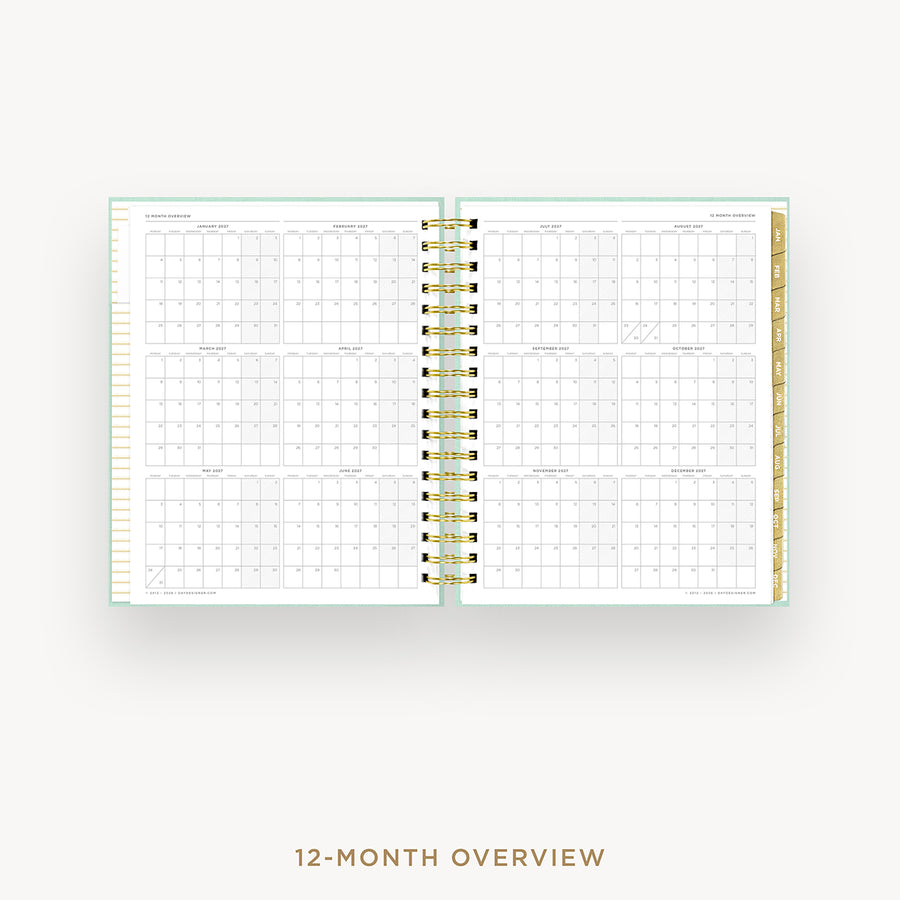 Spiral-bound planner with grid layout on a white background