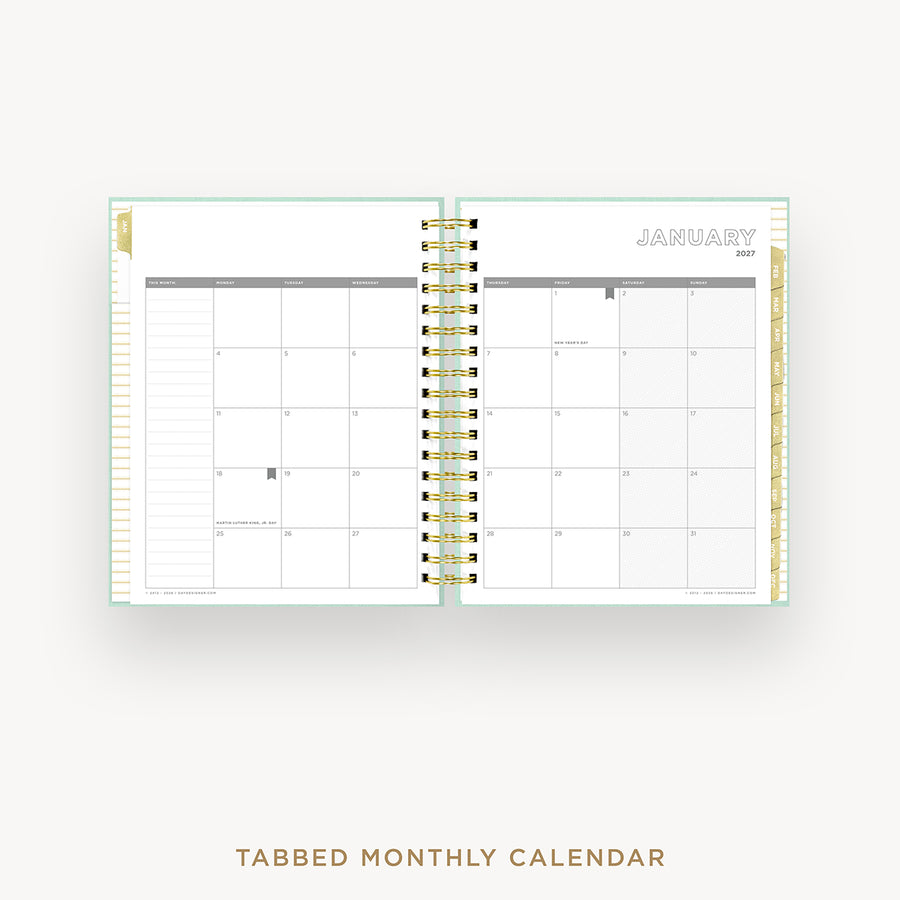 Tabbed monthly calendar open to January on a white background