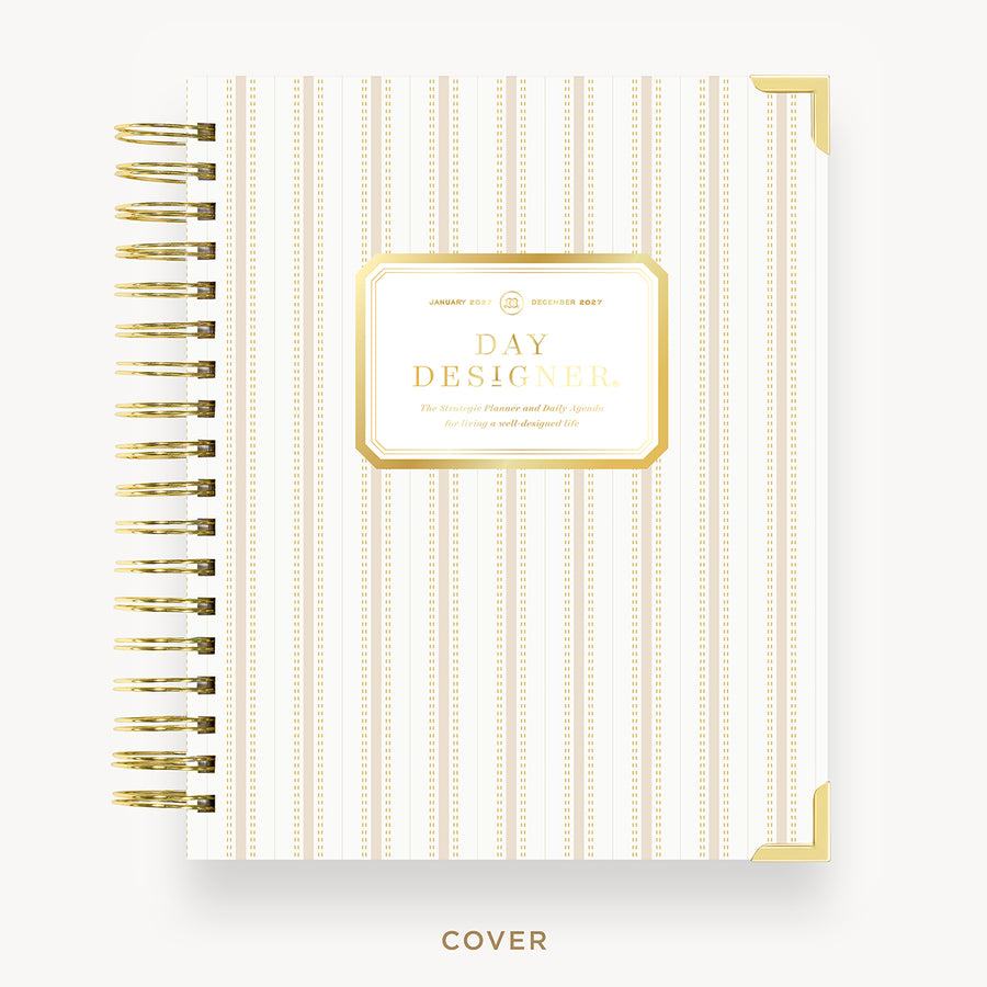 White planner cover with gold accents and 'Day Designer' branding on a white background