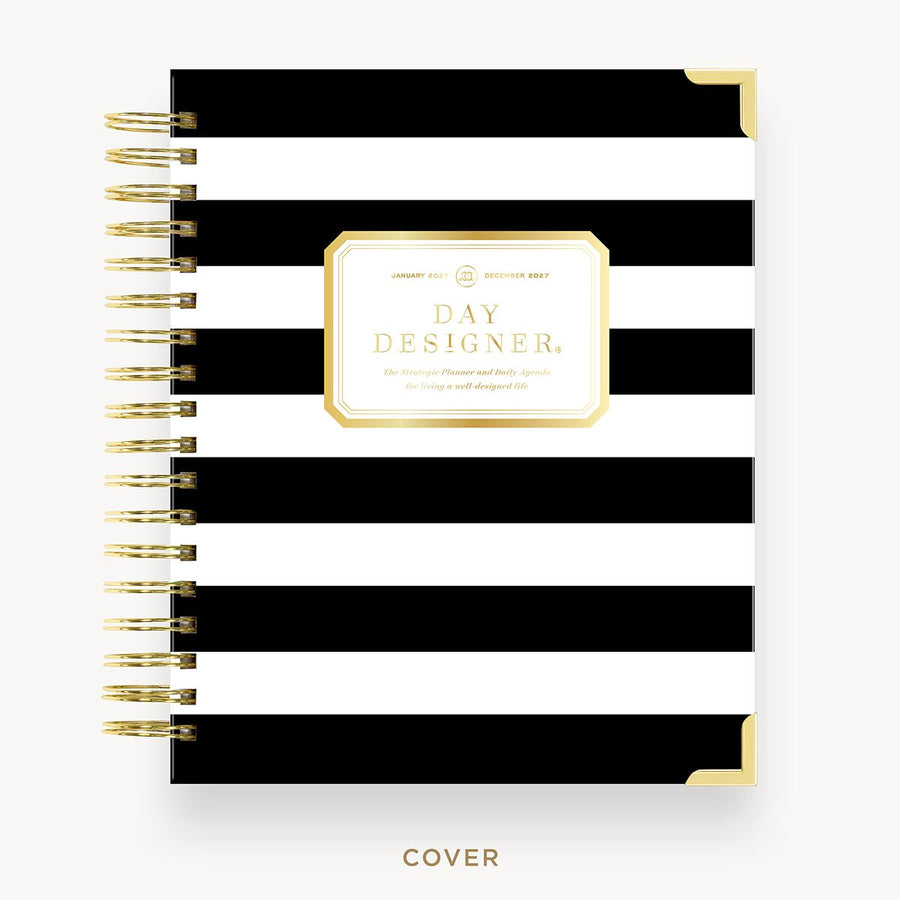 Black and white striped notebook with gold accents on a white background