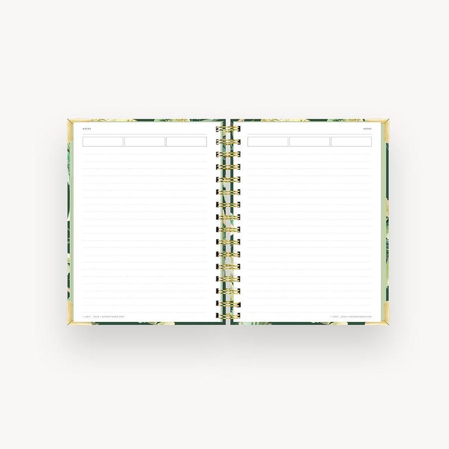 open mini notebook with lined notes pages, green liner