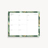 weekly planning pad with green and gold palm border on a white background