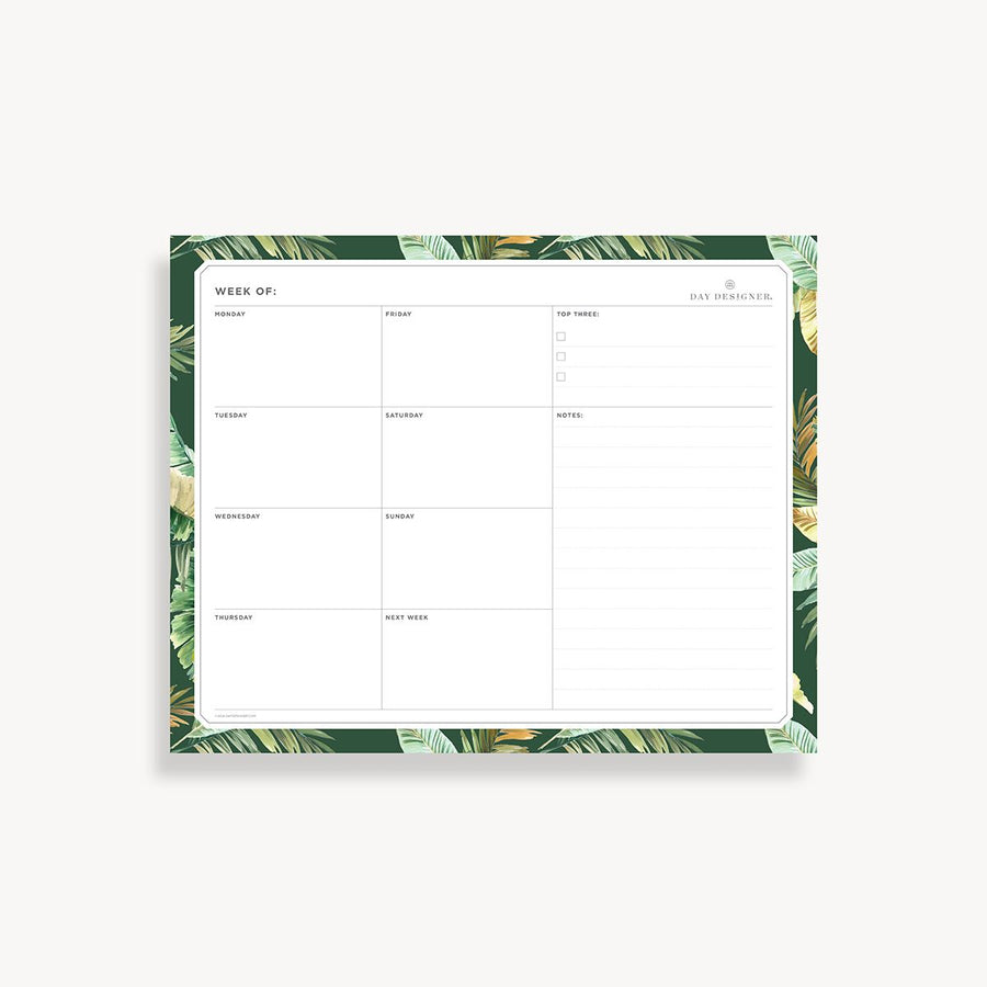 weekly planning pad with green and gold palm border on a white background