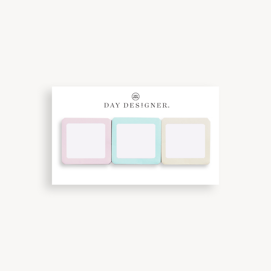 set of three square sticky notes in assorted colors on a white background