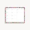 weekly planning pad with pink, purple, red, green floral border on a white background