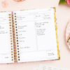 Day Designer 2024-25 daily planner: Camellia opened with writing on it