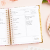 Day Designer 2025 daily planner: Camellia opened with writing on it