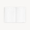 White open notebook with lined notes pages on a white background