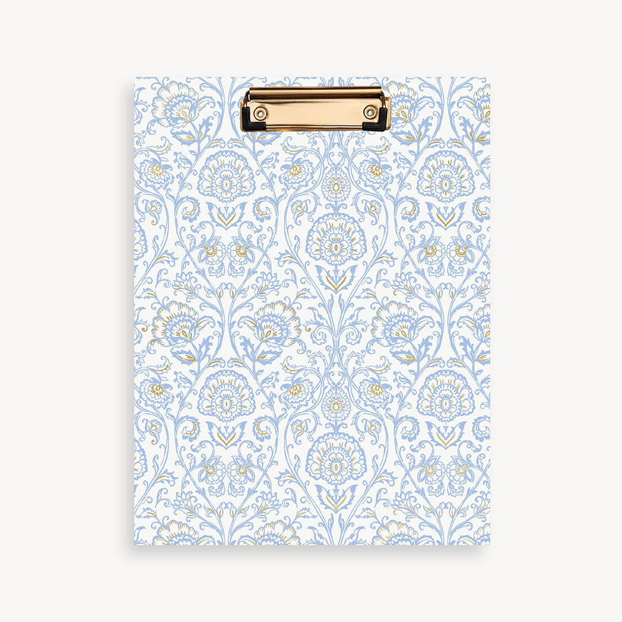 repeated light blue and gold classic pattern clipfolio with gold clip on a cream background