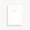 White notebook with gold polka dots and 'NOTES' label on a white background