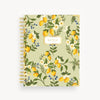 Notebook with lemon and floral pattern on a light green background