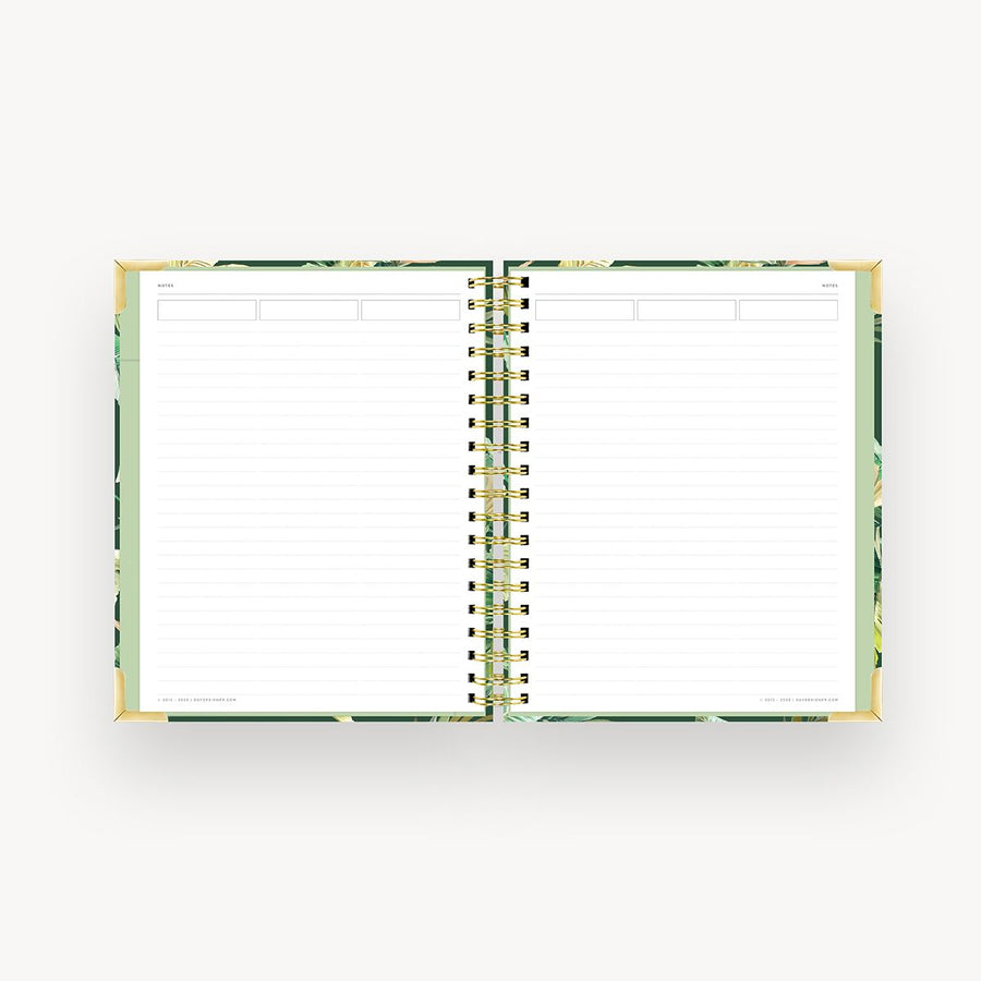 open notebook with lined notes pages, green liner