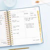 Day Designer 2026 daily planner: navy bookcloth opened with writing on it