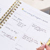 written on planner page with gold stickers