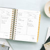 Day Designer 2026 mini daily planner: black stripe opened with writing on it