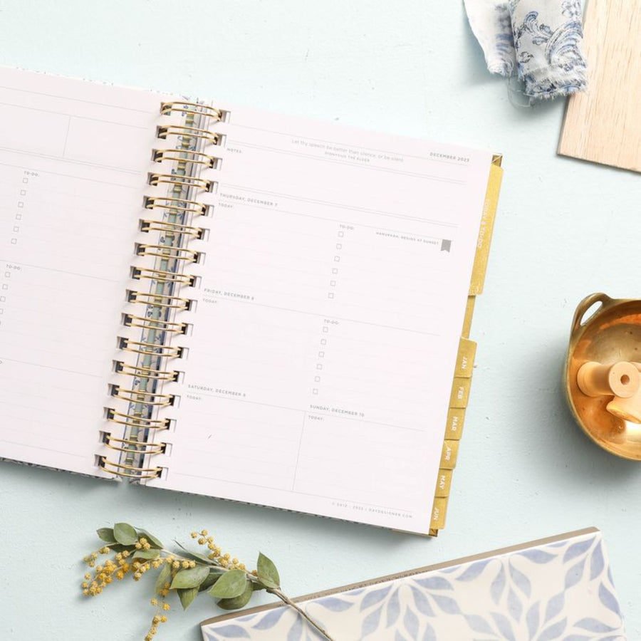 mini weekly open book planner, light blue background, dried flower, gold dish, blue and white fabric