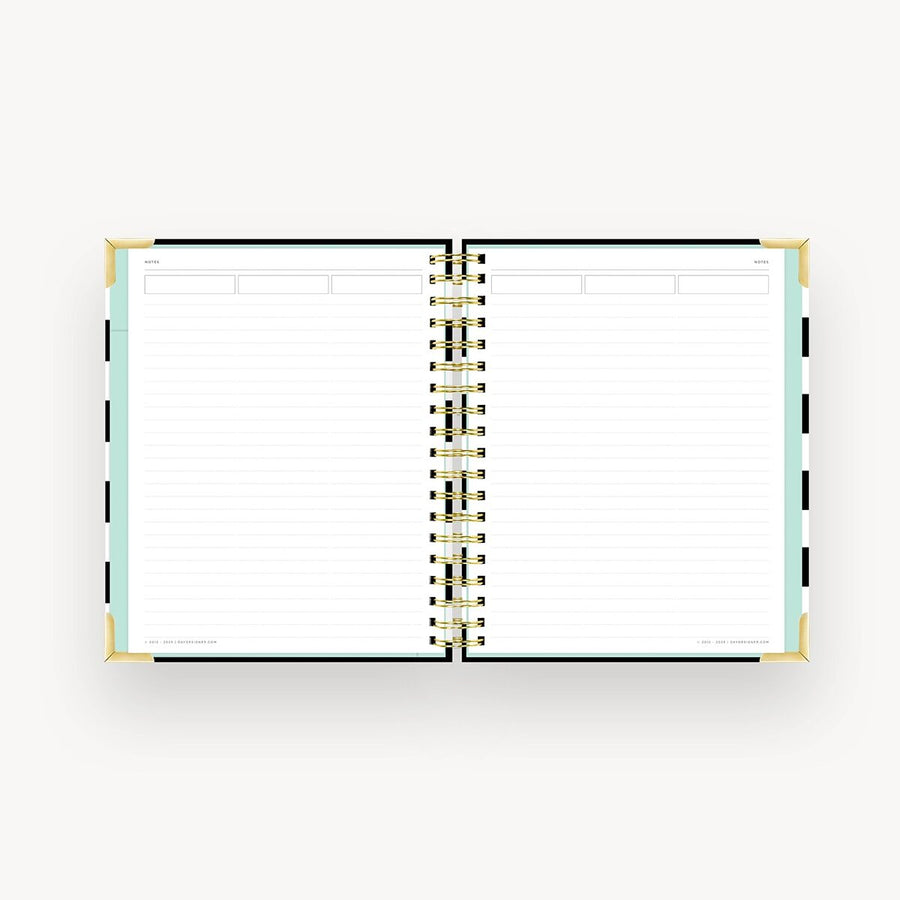 Open planner with spiral binding on a white background