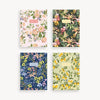 Four floral-patterned notebooks on a white background