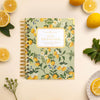 day designer mini weekly planner with lemons, flowers, sage green cover, lemon background