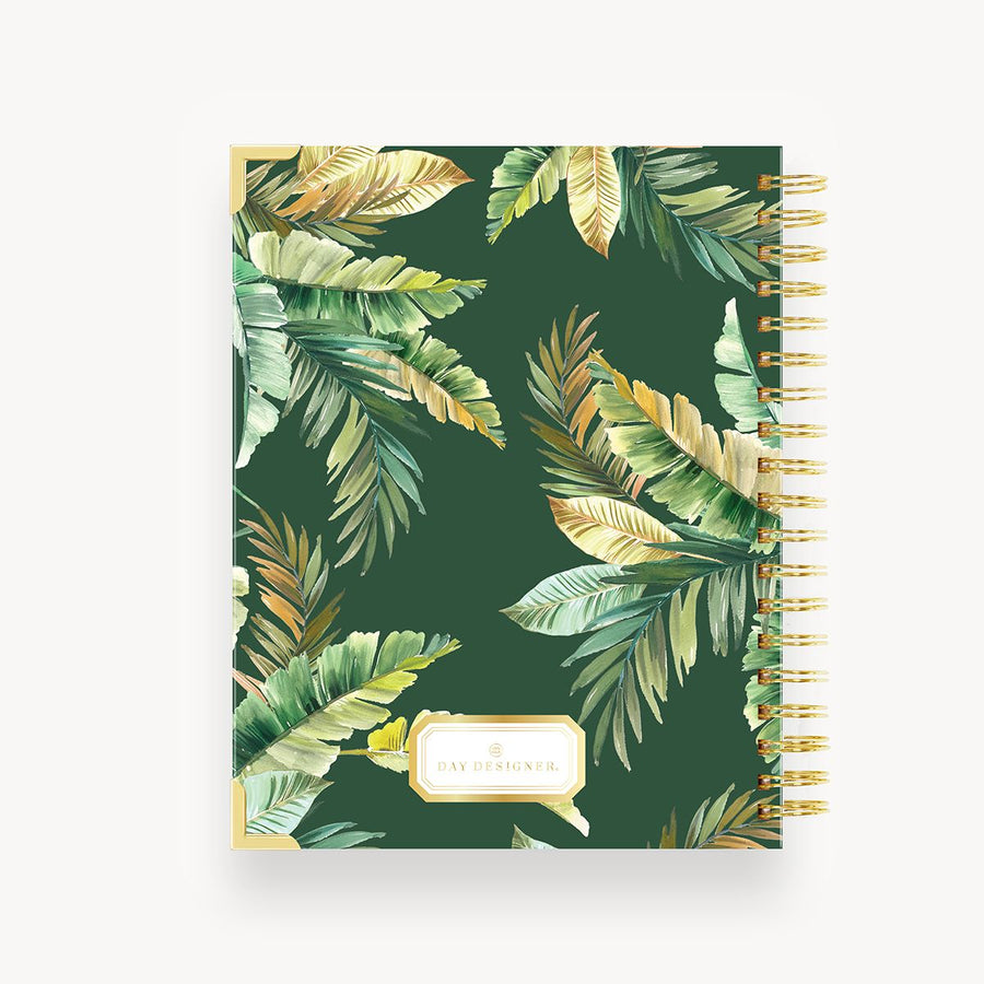 notebook back cover with green and gold tropical leaves on dark green background, gold binding and day designer logo