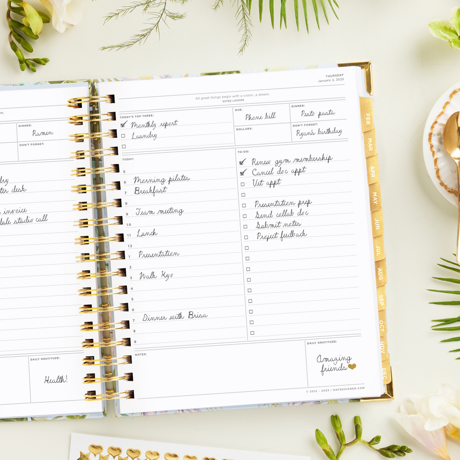 Day Designer 2025 daily planner: Palmetto opened with writing on it