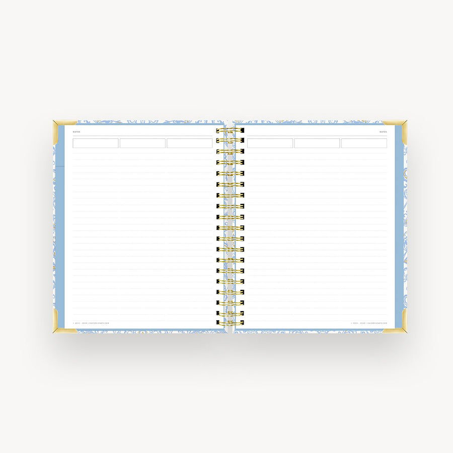 light blue notebook open to lined pages