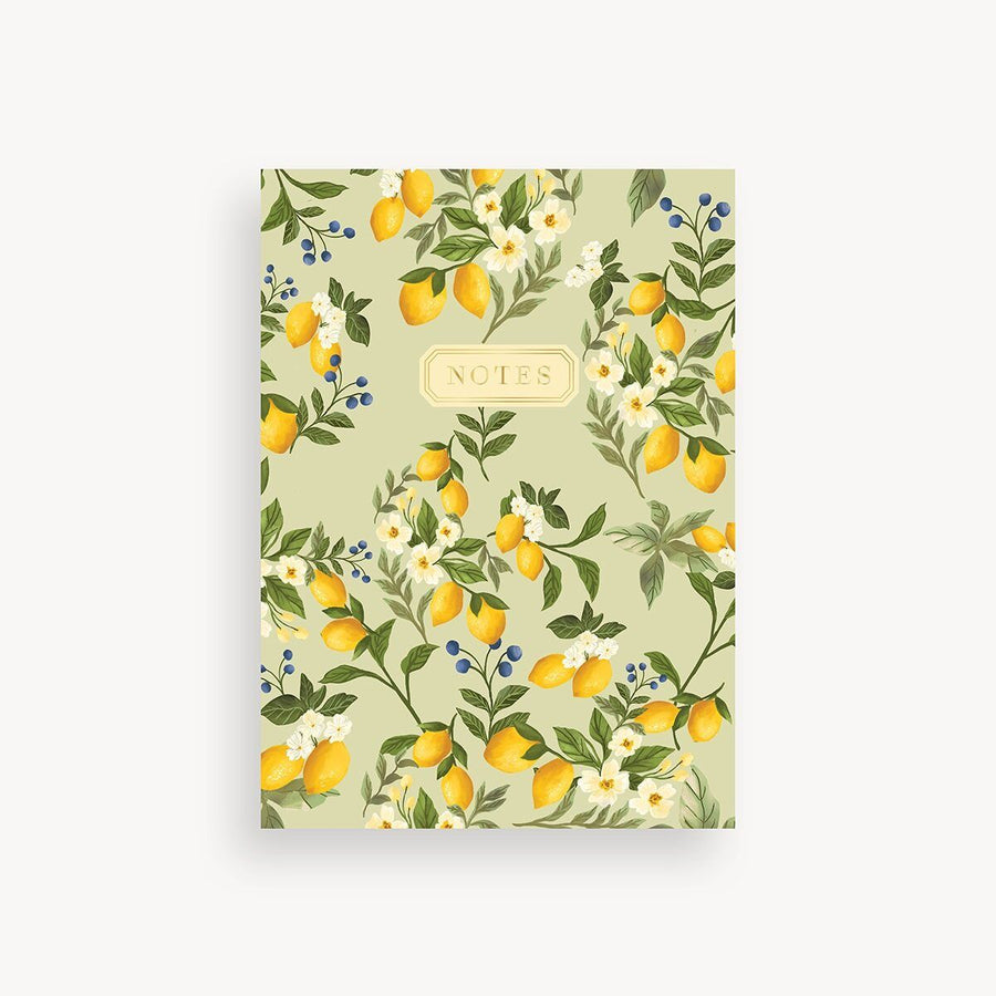 Notebook with lemon and floral design on a light green background