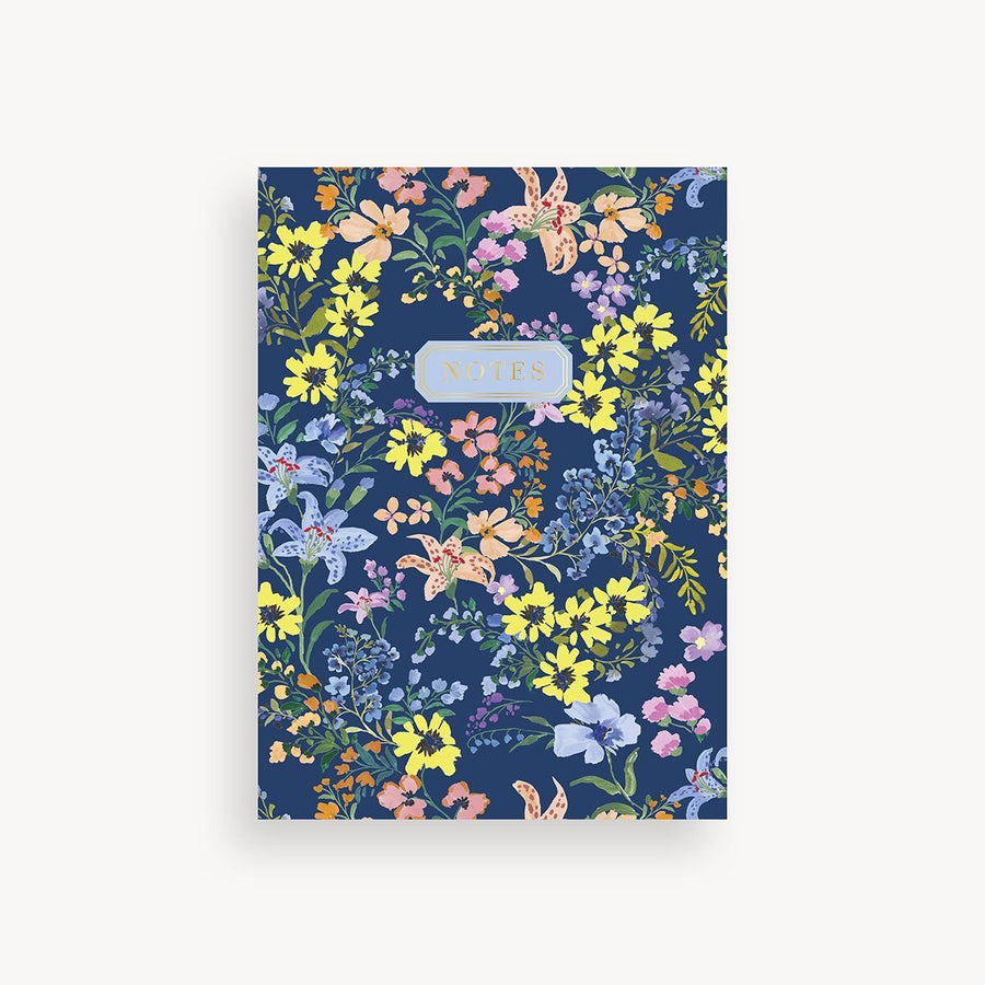 Floral notebook with a blue background on a white background