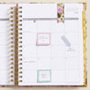 open book planner, written on page, july 2024 calendar, gold monthly tabs, sticky tabs, page marker