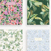 Four notebooks with floral and nature-themed covers on a white background