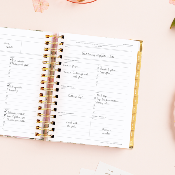 Day Designer 2025 mini weekly planner: Camellia opened with writing on it