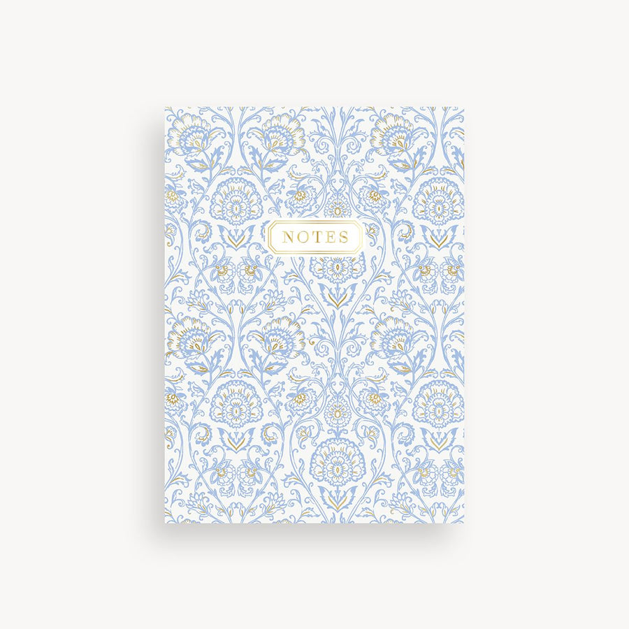 slim mini notebook with classic blue and gold repeated design and gold title accent