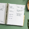 Day Designer 2023-24 Daily Planner Bali opened with writing on it