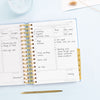 Day Designer 2023-24 Mini Daily Planner Chambray Bookcloth opened with writing on it