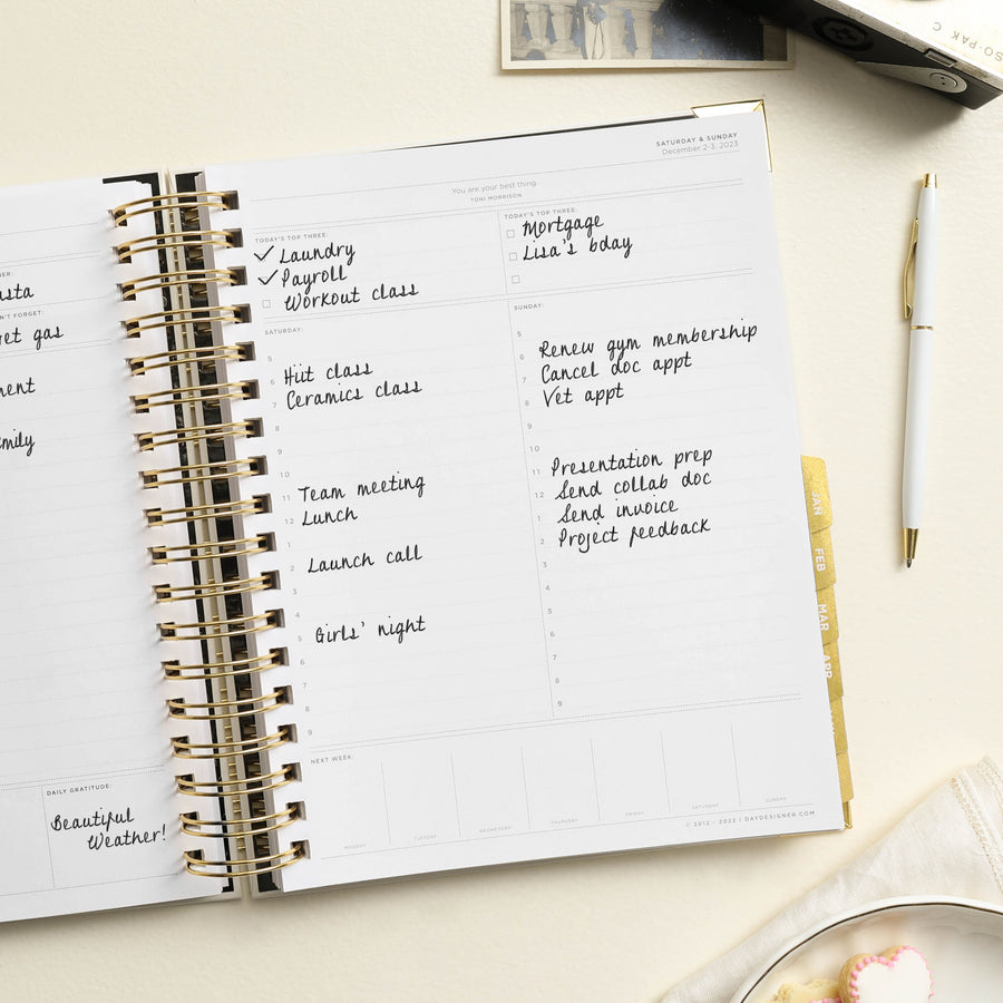 Day Designer 2023-24 Daily Planner Classic Dot opened with writing on it
