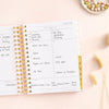 Day Designer 2023-24 Mini Daily Planner Peony Bookcloth opened with writing on it