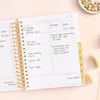 Day Designer 2023-24 Daily Planner Peony Bookcloth opened with writing on it