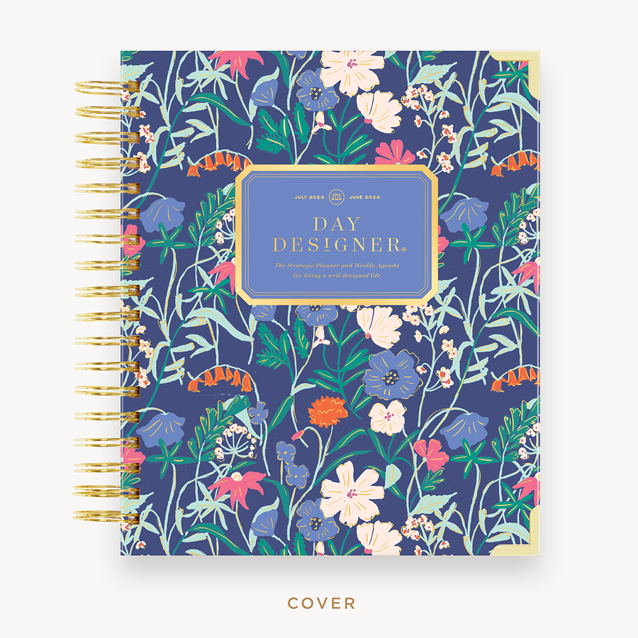Day Designer's 2023-24 Weekly Planner with Wildflowers hard cover and gold spiral binding.