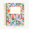 Day Designer's 2023 Weekly Mini Planner with Blurred Spring  hard cover and gold spiral binding.