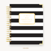 Day Designer's 2023 Weekly Planner with Black Stripe hard cover and gold spiral binding.