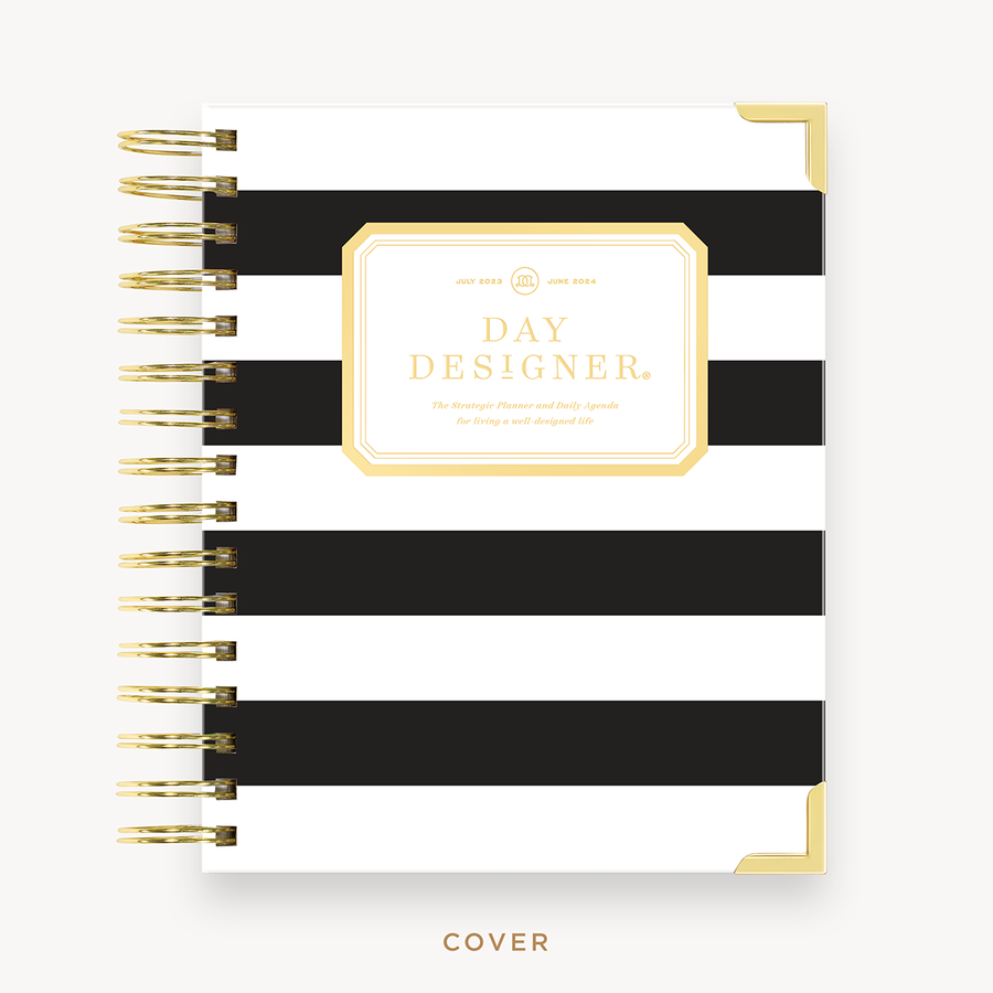 Day Designer's 2023 Daily Mini Planner with Black Stripe hard cover and gold spiral binding.