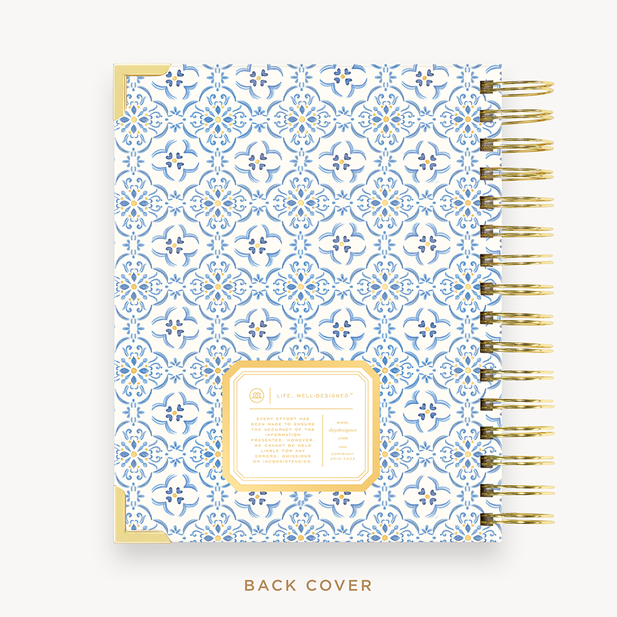 Day Designer's 2023 Weekly Mini Planner with Casa Bella back cover and gold spiral binding.