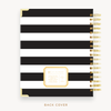 Day Designer's 2023 Weekly Planner with Black Stripe back cover and gold spiral binding.