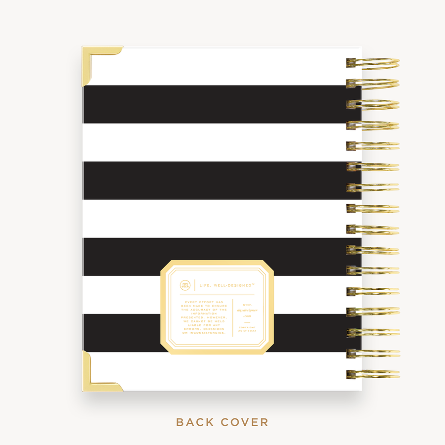 Day Designer's 2023 Daily Mini Planner with Black Stripe back cover and gold spiral binding.
