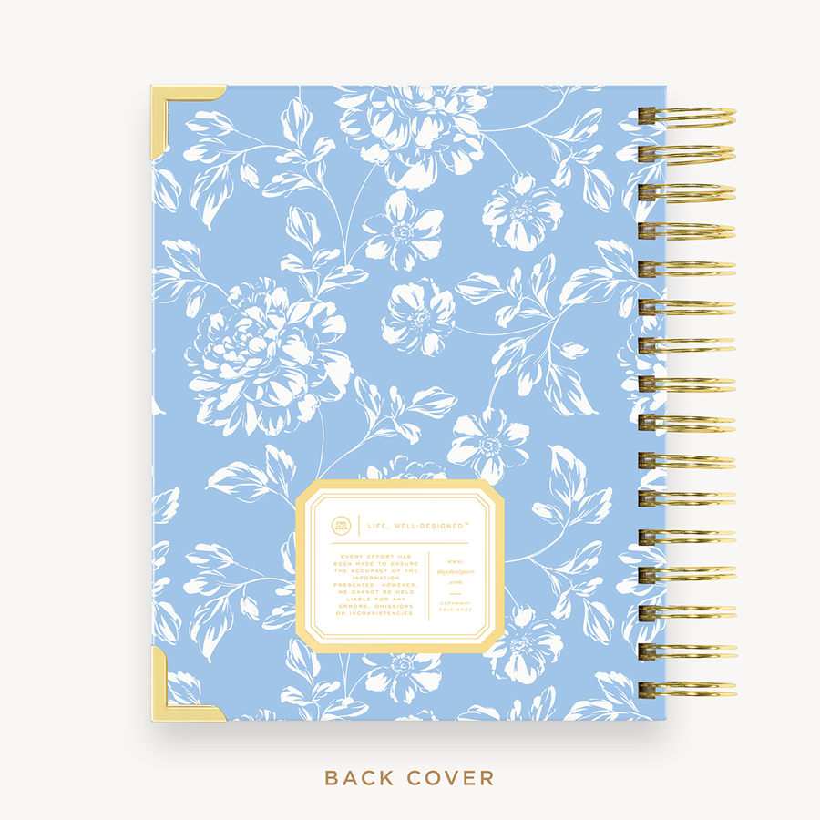 Day Designer's 2023 Daily Mini Planner with Annabel back cover and gold spiral binding.
