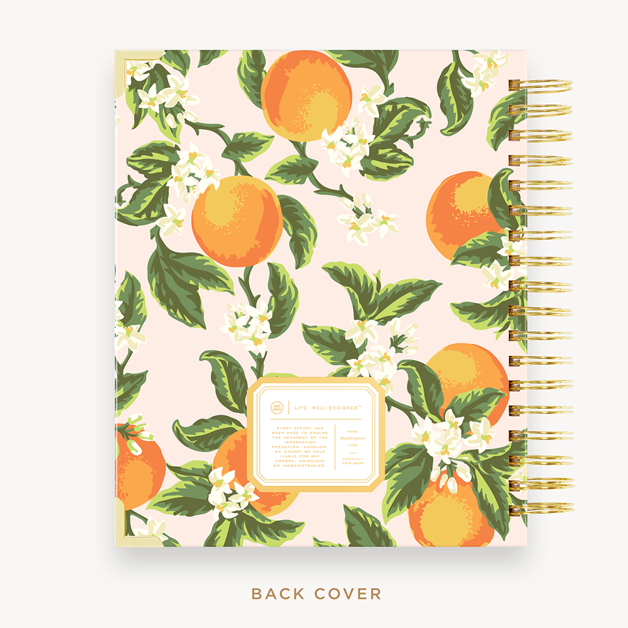 Day Designer's 2023-24 Weekly Planner with Orange Blossom back cover and gold spiral binding.