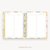 Day Designer's 2023-24 Weekly Planner Orange Blossom with movie and book tracking page.